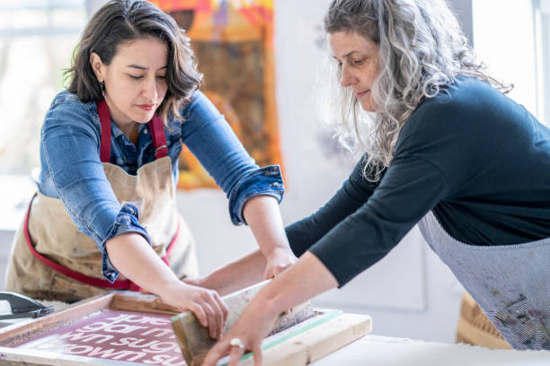 istock Two female artists screen printing fabric 1248049724