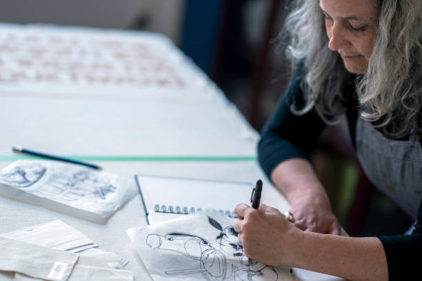 istock Textile artist sketching out a design to screen print 1248049788