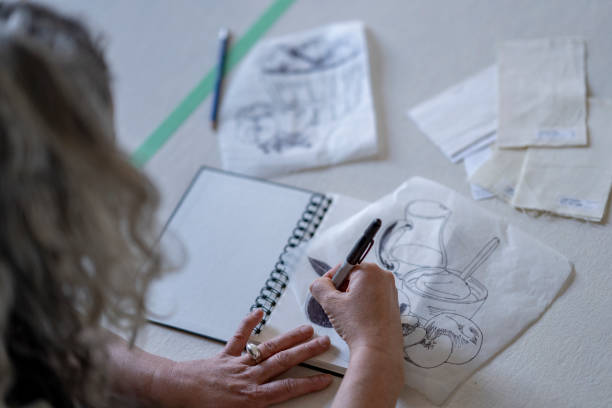 istock Textile artist sketching out a design to screen print 1248049828