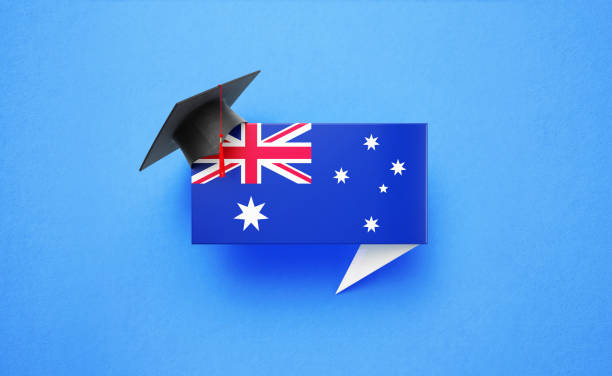 istock Graduation Cap Sitting Over A Speech Bubble Textured with Australian Flag on Blue Background 1248054919