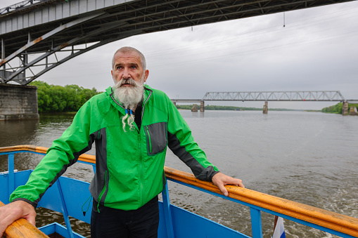 Portrait Senior Man with White Beard on a journey through the Russian rivers,Oka