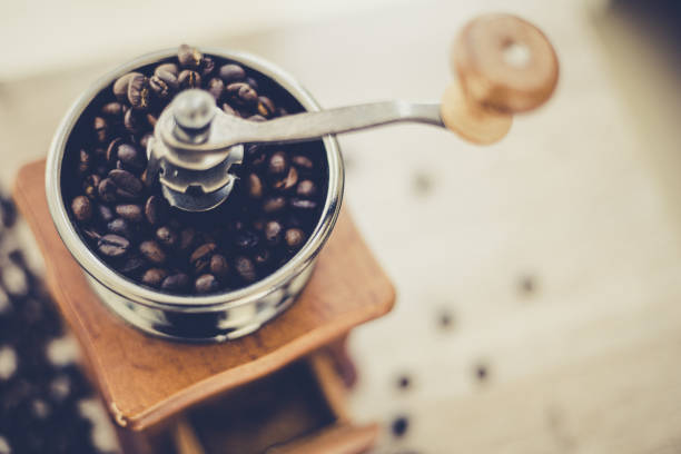 istock Roasted coffee beans in vintage style grinder 1248066260