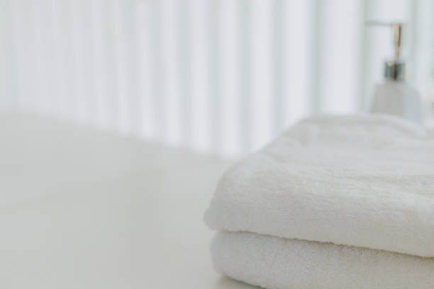 istock Shampoo and shower cream bottle with towel 1248066278