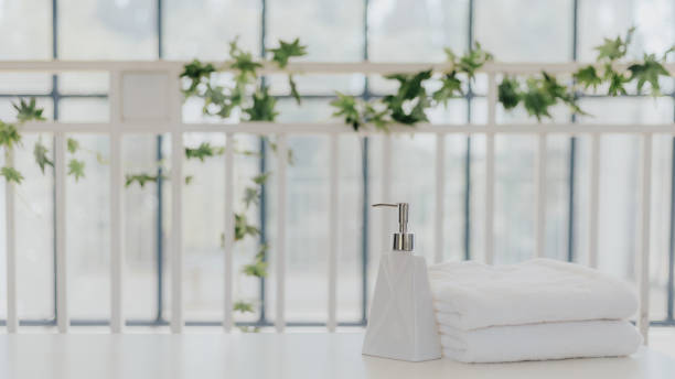 istock Shampoo and shower cream bottle with towel 1248066308