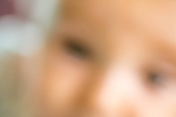 Blurred defocused baby portrait open eyes