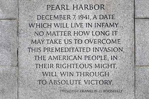 Washington, D.C., USA - November 11, 2017: Inscription about Pearl Harbor on the World War II Memorial, located on the National Mall.