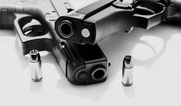 istock Two pistols on a white background 1248081891