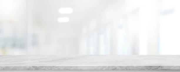 istock Empty white marble stone table top and blur glass window interior lobby and hall way banner mock up abstract background - can used for display or montage your products. 1248083870