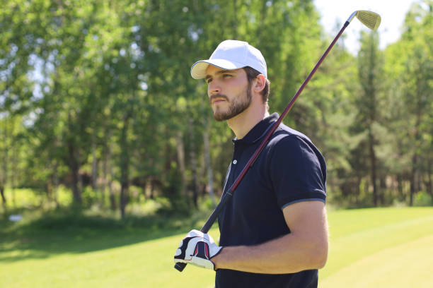 istock Man playing golf on beautiful sunny green golf course. 1248088742