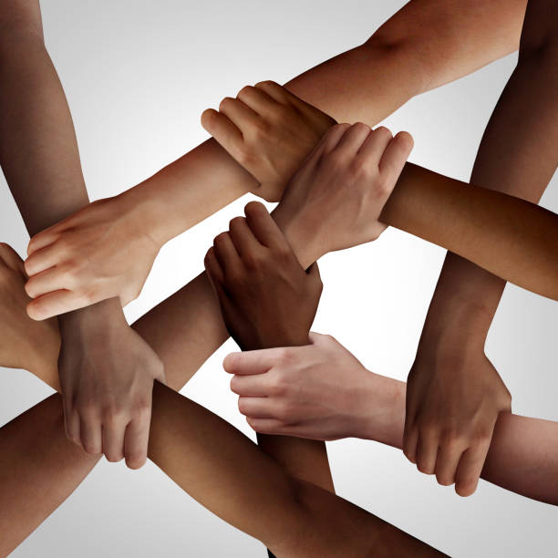 Racism Racism and human civil rights as diverse people of different ethnicity holding hands together as a social solidarity concept of a multiracial group working as united partners. social justice concept photos stock pictures, royalty-free photos & images
