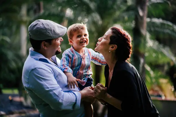 Photo of Parents goofing around with their boy