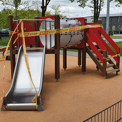 The children's playground is surrounded by a stop bar, protection against pandemics and the spread of the corona virus