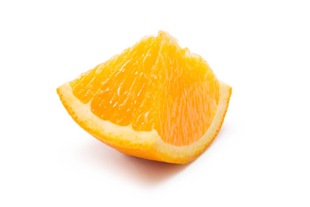 istock Orange fruit cut into pieces isolated on white. Clipping path. 1248105728
