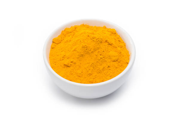 istock Turmeric powder in white bowl isolated on white. Clipping path. 1248105739