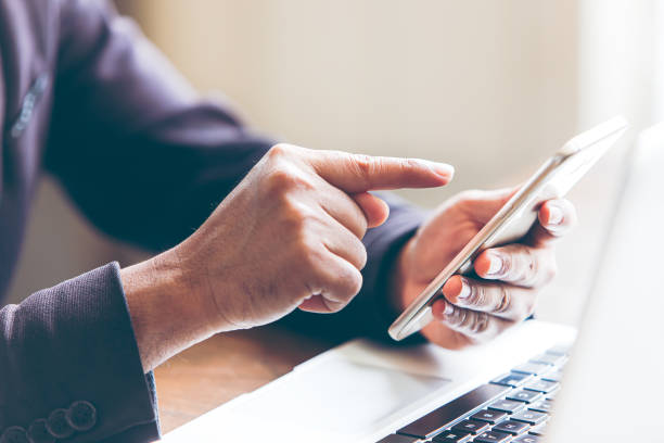 istock Men who use smartphones composing and sending send and receive emails read messages and help purchase products online on the website ,networking event Internet online, online shopping platform 1248106276