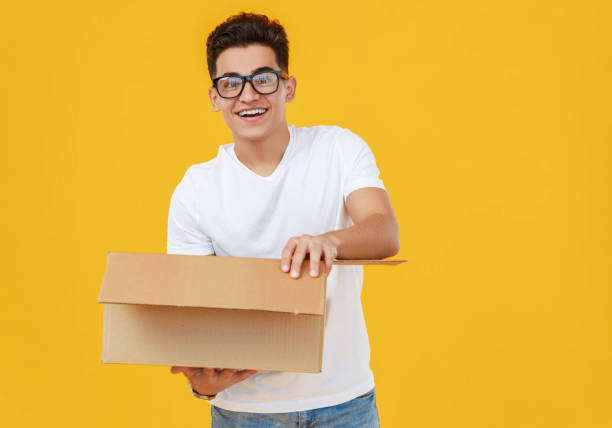istock Astonished man looking inside carton box 1248109968