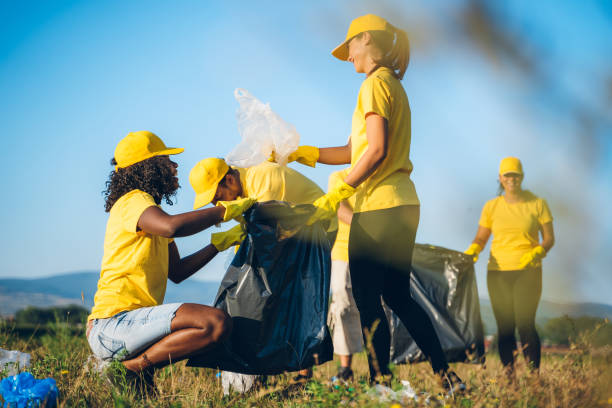 istock People cleaning up garbage in nature 1248113847