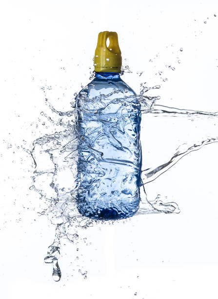 istock Plastic water bottle with water splash in the air isolated on white background 1248113874