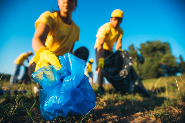 istock People cleaning up garbage in nature 1248114007