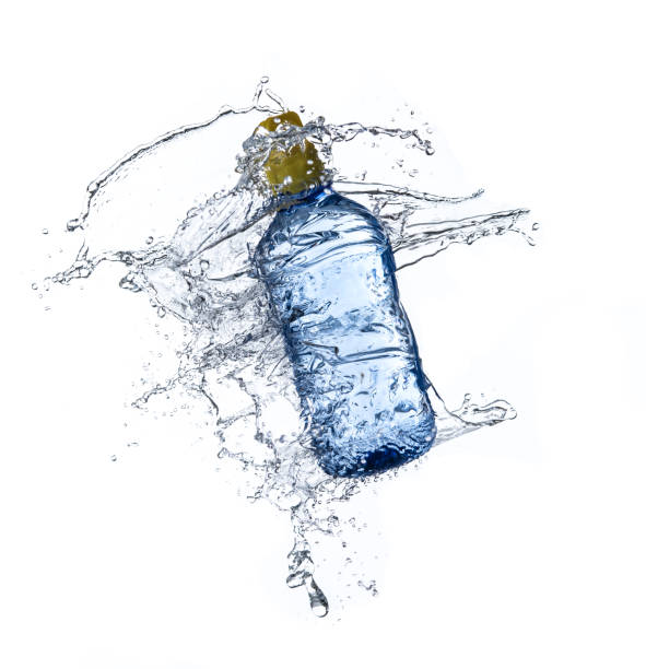 istock Plastic water bottle with water splash in the air isolated on white background 1248114209