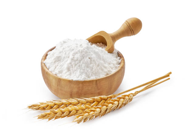 istock Wheat flour in bowl and spikelets isolated on white 1248119131