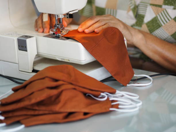 istock Sewing machine accessories sew face mask fabric material protection from virus covid-19 dust diseases and healthcare woman working 1248120757