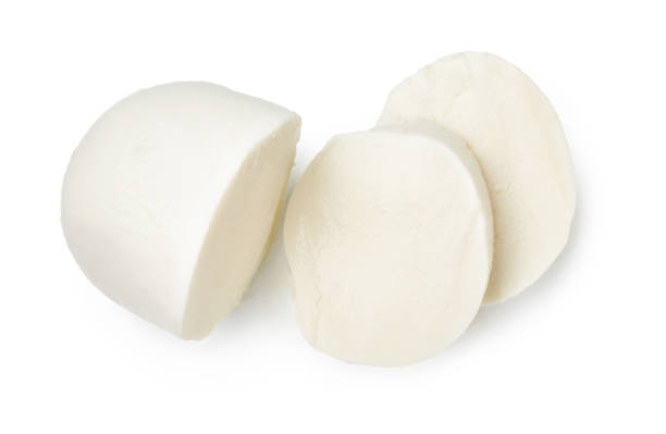 Pieces of mozzarella Buffalo cheese isolated on white background. Top view of sliced cheese. stock photo