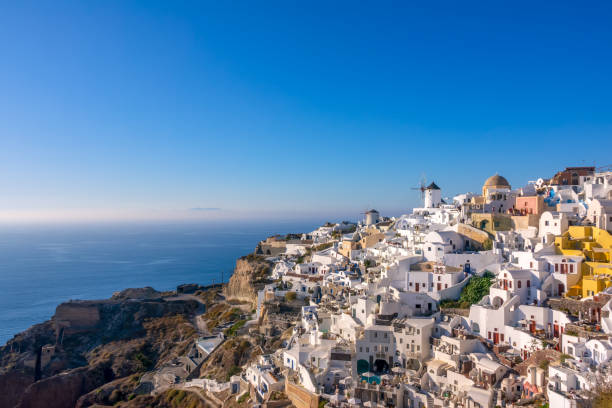 istock White Houses and Windmills on a Mountainside in Santorini 1248121144