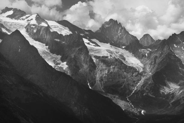 istock Melting mountain glaciers, global warming, Caucasus Mountains, black and white landscape 1248122810