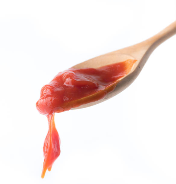istock tomato sauce in the spoon isolated on white background 1248124557