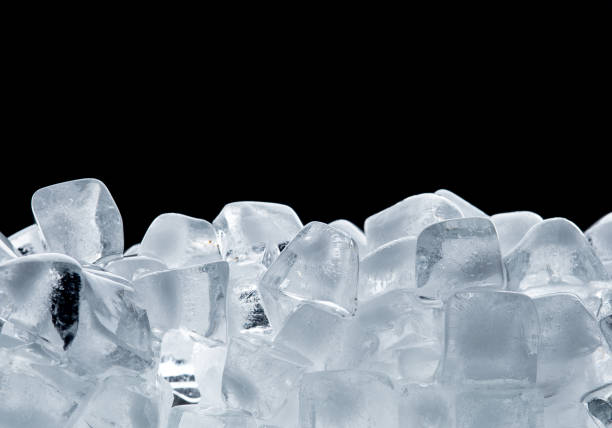 istock Ice cubes isolated on black background 1248125133