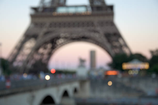 istock Blurred background silhouette eiffel tower in Paris with defocus bokeh and sunset light 1248126232
