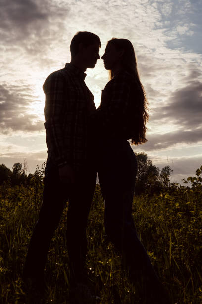 istock Loving couple in the field. Sunset. 1248130548