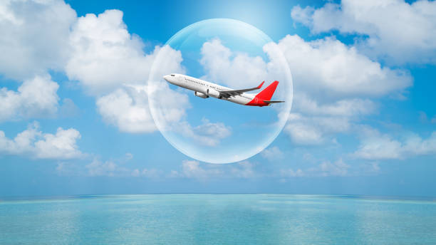 Airplane traveling in bubble representing international travel bubble project to revive tourism and hotel industry Travel bubble concept - Airplane traveling in bubble representing international travel bubble project to revive tourism and hotel industry among countries that show good control of covid 19 spreading. auckland region photos stock pictures, royalty-free photos & images