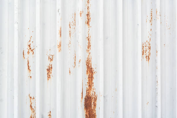 istock Red spots of rust on the white metal texture construction copy space for text title abstract 1248130823