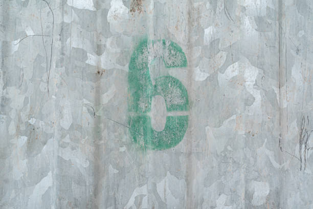 istock Number 6 Spray paint on the steel doors with rust stains garbage can vintage tone copy space for text 1248130863