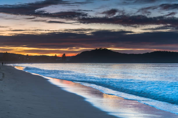 istock Sunrise at the Beach with Clouds 1248134473