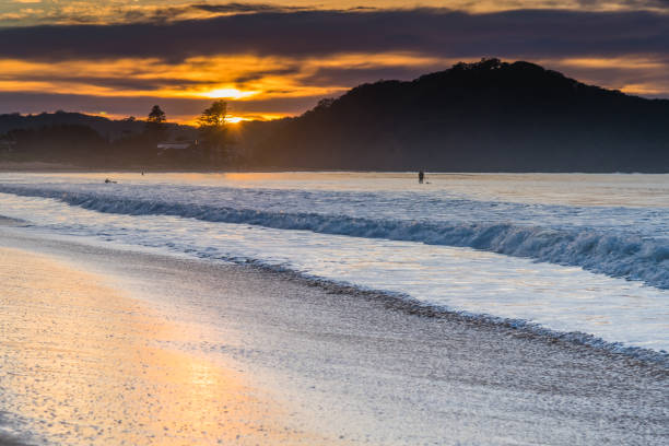 istock Sunrise at the Beach with Clouds 1248134545