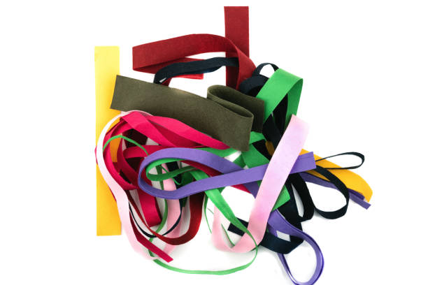 istock Multi-colored strips of felt fabric on white background. A kind of felt, non-woven material. 1248135555