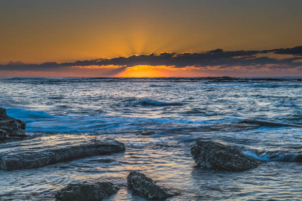 istock Sunrise Seascape with a low cloud bank 1248135863