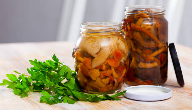 istock Assorted marinated mushrooms in glass jar 1248136284