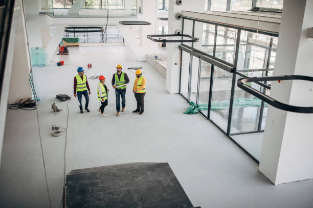 istock Architects and engineers walking at construction site indoors 1248137558