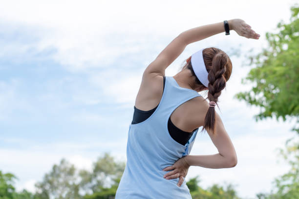istock Asian wman runner warm up before a morning workout in the park. 1248137606