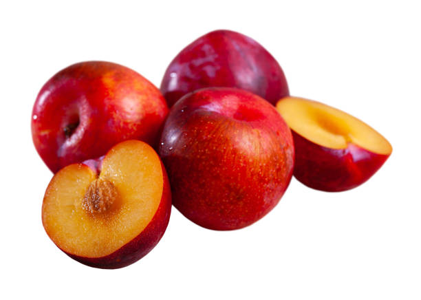 istock Whole and halves red appetizing plums 1248140567