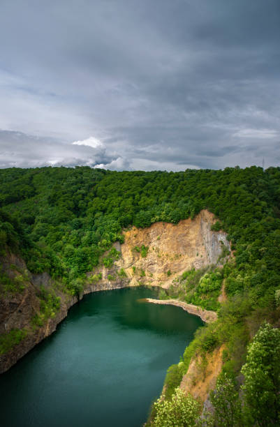 istock Beautiful vibrant blue green deep mountain lake 1248140782