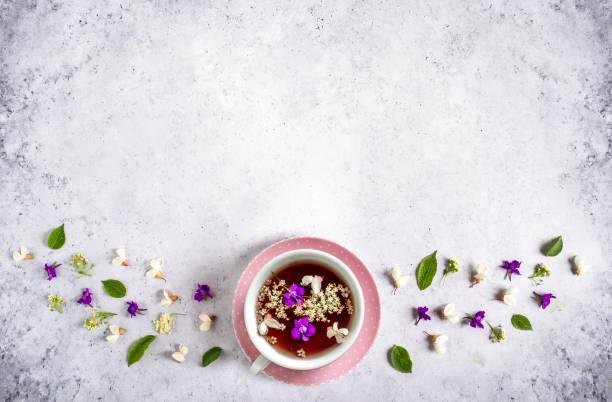 istock Vintage background with fresh spring flower tea and blossoms 1248141380