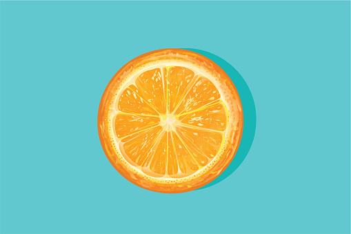 Fresh orange cut in half on a blue background