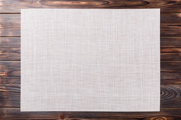 istock Top view of empty white table napkin for dinner on wooden background with copy space 1248148544
