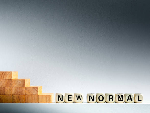 istock New Normal, word on wooden alphabet cube. 1248151370