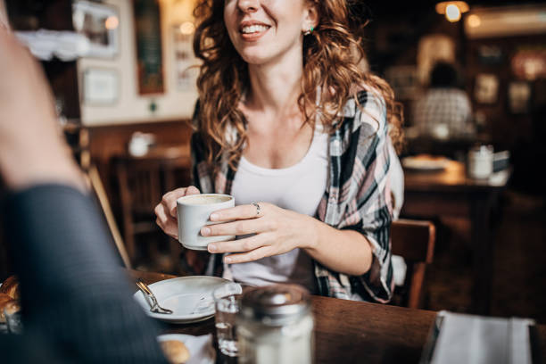 istock Young woman drinking coffee in coffee shop 1248153716
